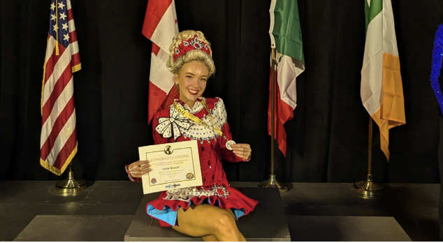 Dancing with pride: Junior Sadie Breault presents her qualification certificate for the Irish Dancing World Championships. She qualified to represent North America this past June.
